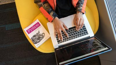 woman programming on a notebook