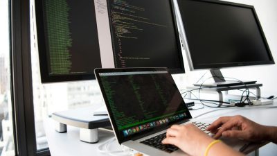 close up photo of person typing on laptop