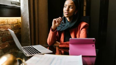 woman wearing turban working on laptop