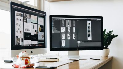 two desktops on a table